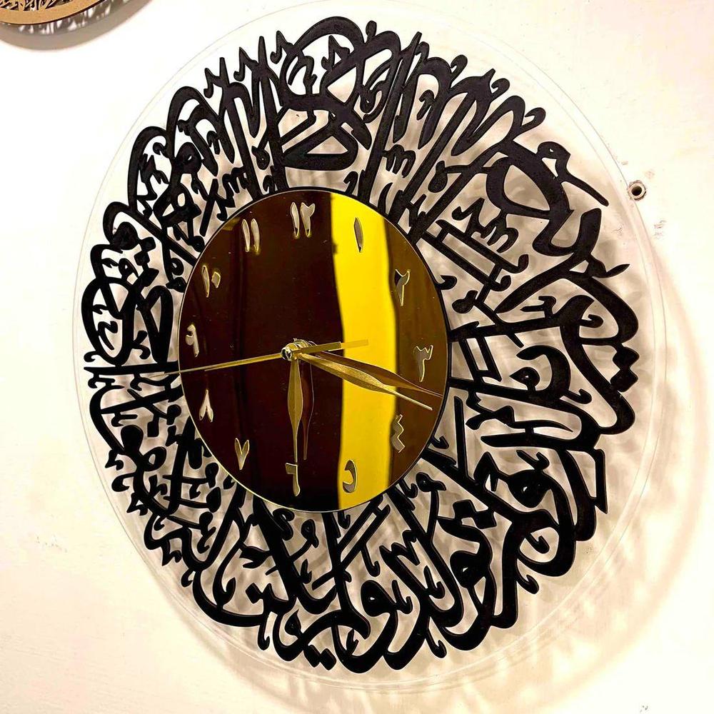 Qul Calligraphy Acrylic Wall Clock – elegant Islamic wall art combining modern acrylic design with Quranic calligraphy.”

